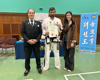 Mr Anthony Harris showing his 5th Dan certificate